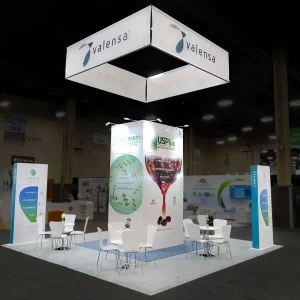 trade show booth with hanging banner